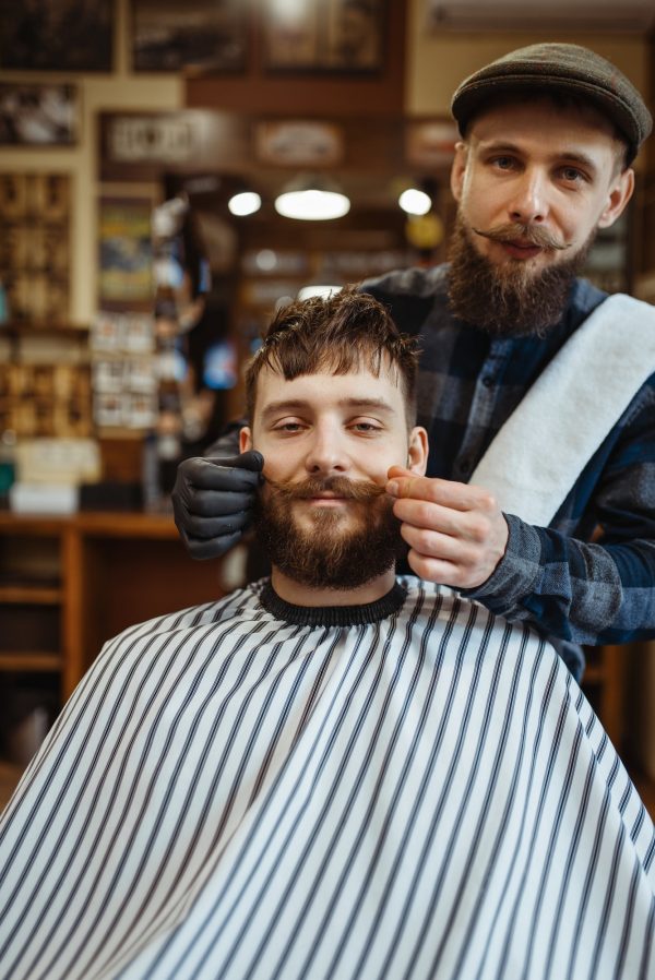 Barber and customer with a mustache, barbershop